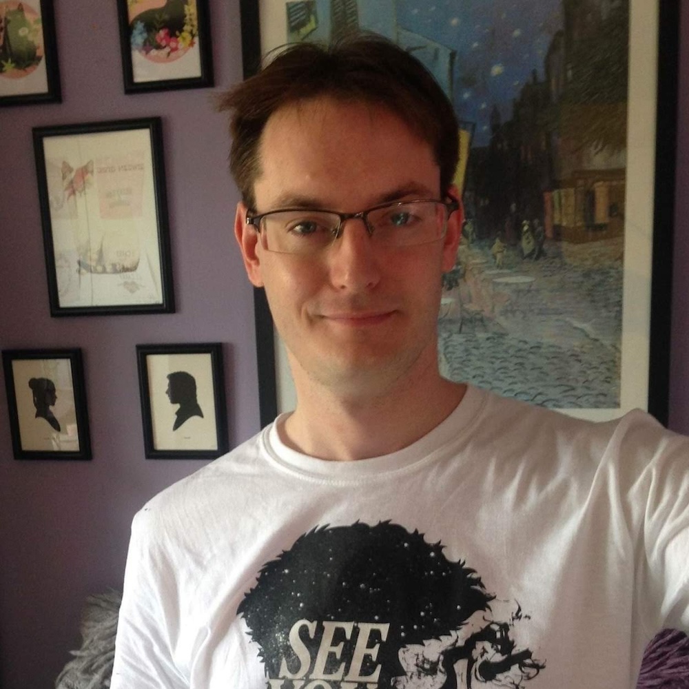 Daniel wearing a white Cowboy Bebop t-shirt that says 'See you space cowboy'